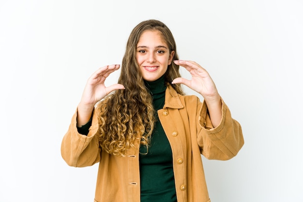 Young caucasian woman holding something with palms