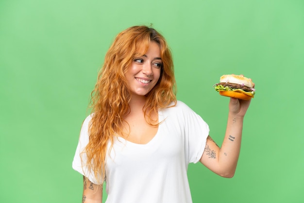 Photo young caucasian woman over isolated background