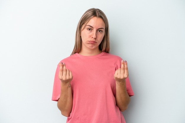 Young caucasian woman isolated on blue background showing that she has no money.