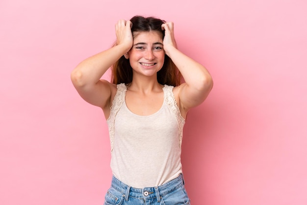 Young caucasian woman isolated on pink background doing nervous gesture