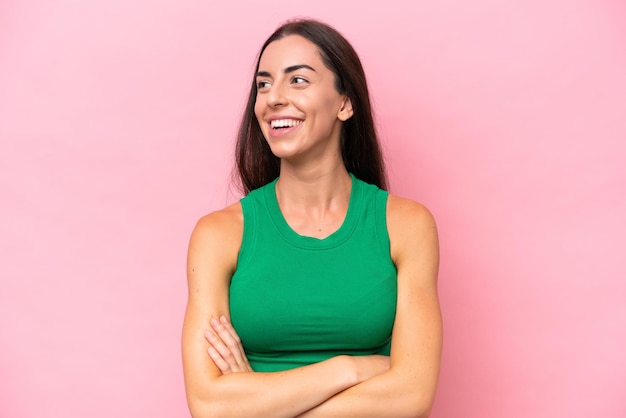 Young caucasian woman isolated on pink background happy and smiling