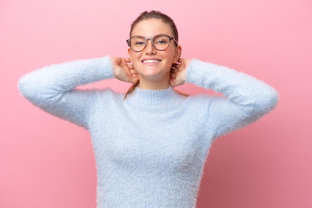 Young caucasian woman isolated on pink background laughing