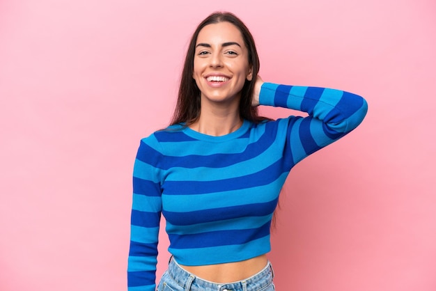 Young caucasian woman isolated on pink background laughing