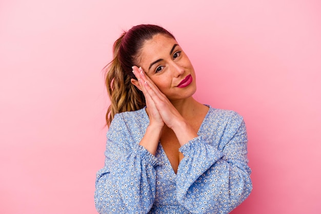 Young caucasian woman isolated on pink cheerful and confident showing ok gesture.