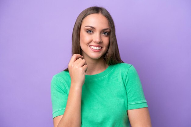 Young caucasian woman isolated on purple background laughing