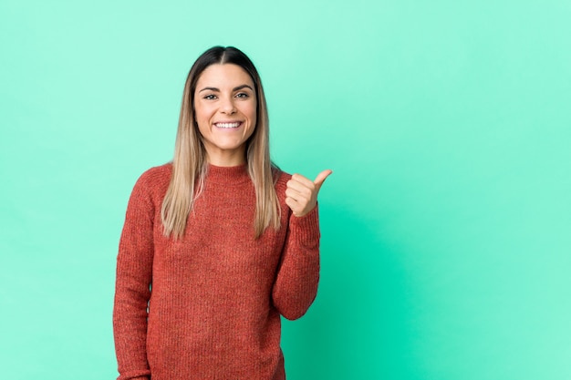 Young caucasian woman isolated smiling and raising thumb up