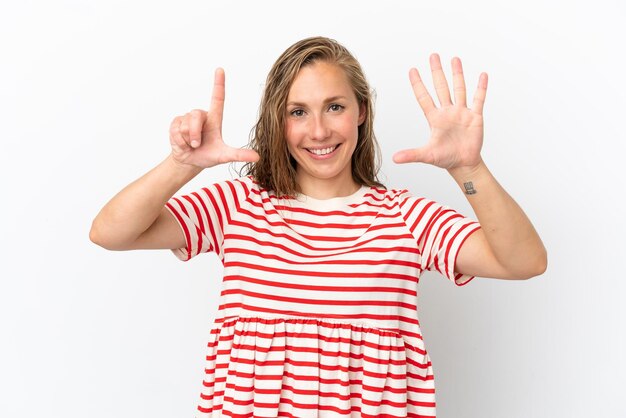 Young caucasian woman isolated on white background counting seven with fingers