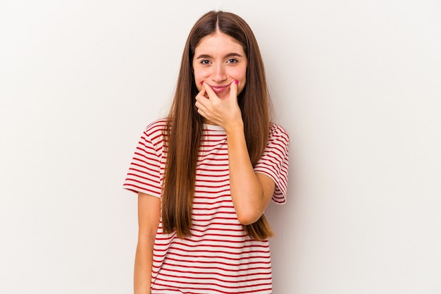 Young caucasian woman isolated on white background doubting between two options.