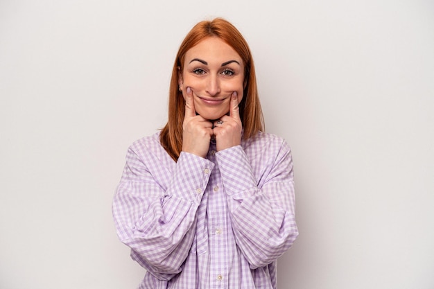 Young caucasian woman isolated on white background doubting between two options