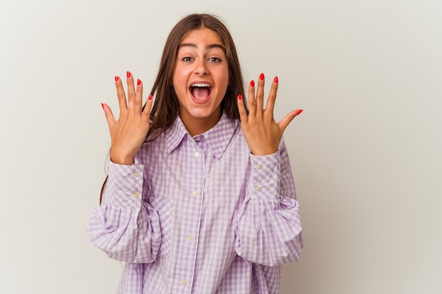 Young caucasian woman isolated on white background feels confident giving a hug to the camera.