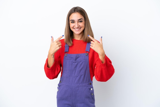 Young caucasian woman isolated on white background giving a thumbs up gesture