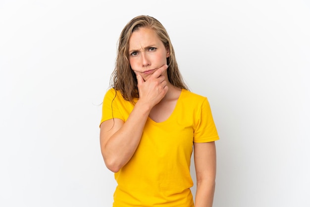 Young caucasian woman isolated on white background having doubts