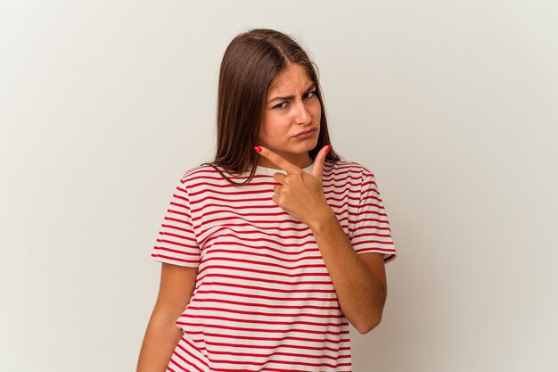 Young caucasian woman isolated on white background having a strong teeth pain, molar ache.