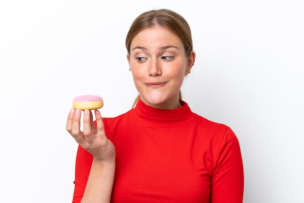 Young caucasian woman isolated on white background holding a donut