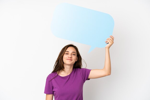 Young caucasian woman isolated on white background holding an empty speech bubble