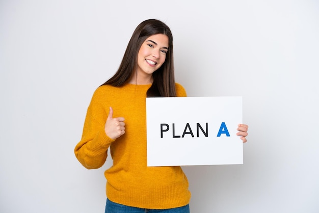 Young caucasian woman isolated on white background holding a placard