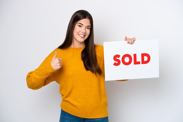 Young caucasian woman isolated on white background holding a placard