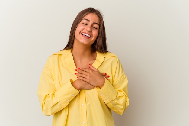 Young caucasian woman isolated on white background joyful laughing a lot. Happiness concept.