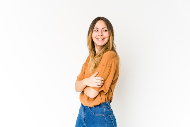 Young caucasian woman isolated on white background laughing and having fun.