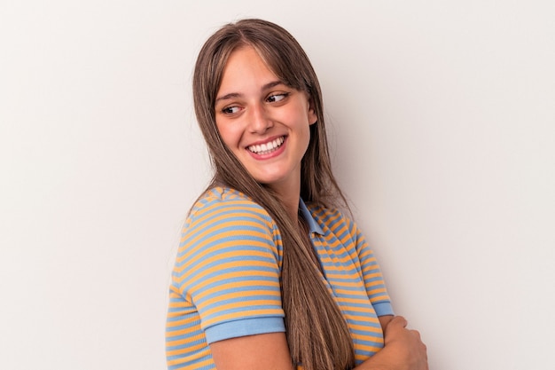 Young caucasian woman isolated on white background laughing and having fun.