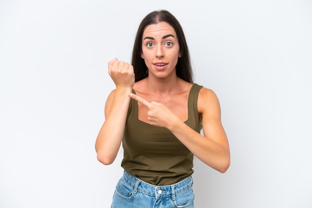 Young caucasian woman isolated on white background making the gesture of being late