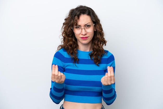 Young caucasian woman isolated on white background making money gesture but is ruined