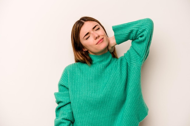 Young caucasian woman isolated on white background massaging elbow suffering after a bad movement