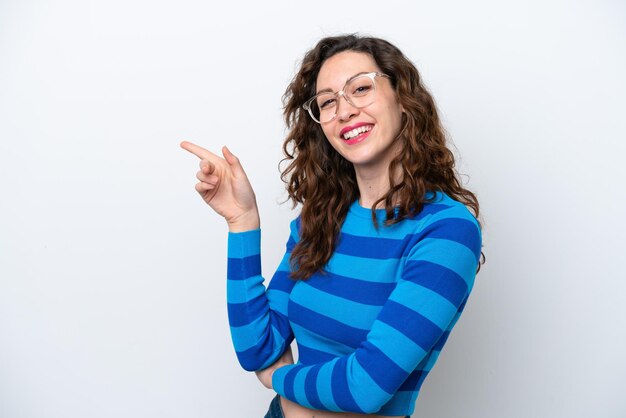 Young caucasian woman isolated on white background pointing finger to the side