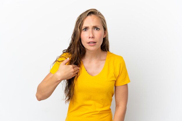 Young caucasian woman isolated on white background pointing to oneself