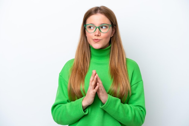 Young caucasian woman isolated on white background scheming something