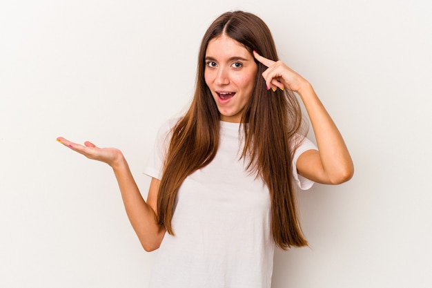 Young caucasian woman isolated on white background showing a disappointment gesture with forefinger.