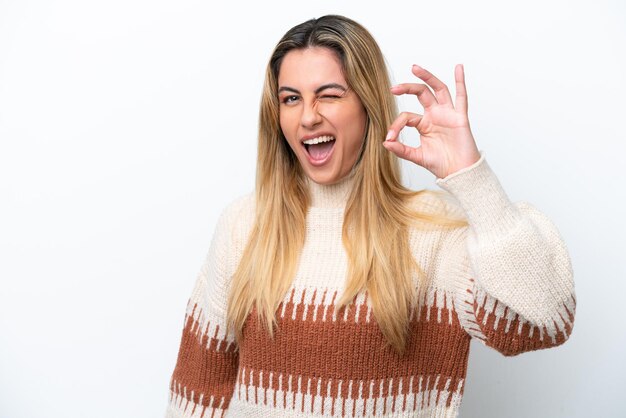 Young caucasian woman isolated on white background showing ok sign with fingers