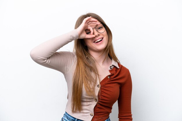 Young caucasian woman isolated on white background showing ok sign with fingers