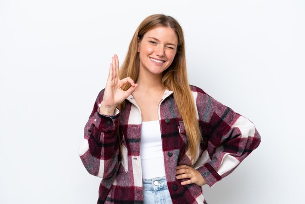 Young caucasian woman isolated on white background showing ok sign with fingers