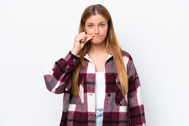 Young caucasian woman isolated on white background showing a sign of silence gesture