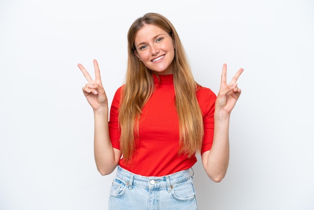 Young caucasian woman isolated on white background showing victory sign with both hands