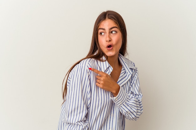 Young caucasian woman isolated on white background smiling confident with crossed arms.