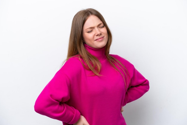 Young caucasian woman isolated on white background suffering from backache for having made an effort