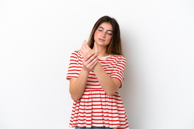 Young caucasian woman isolated on white background suffering from pain in hands