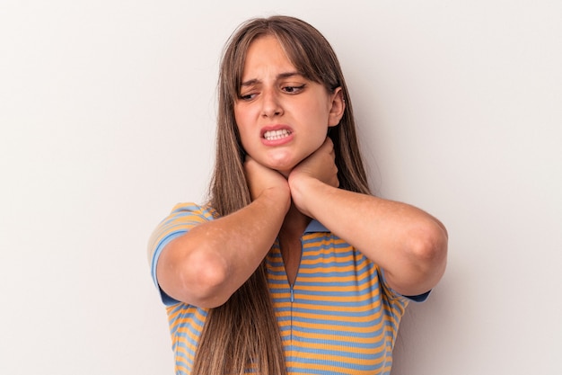 Young caucasian woman isolated on white background suffering neck pain due to sedentary lifestyle.