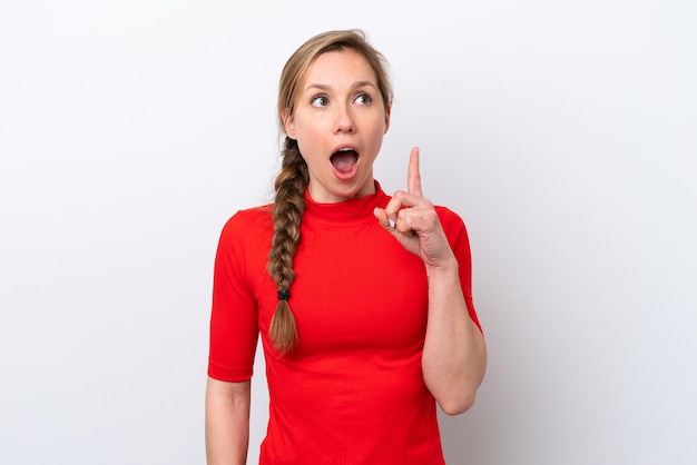 Young caucasian woman isolated on white background thinking an idea pointing the finger up