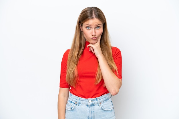 Young caucasian woman isolated on white background and thinking