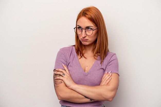 Young caucasian woman isolated on white background tired of a repetitive task