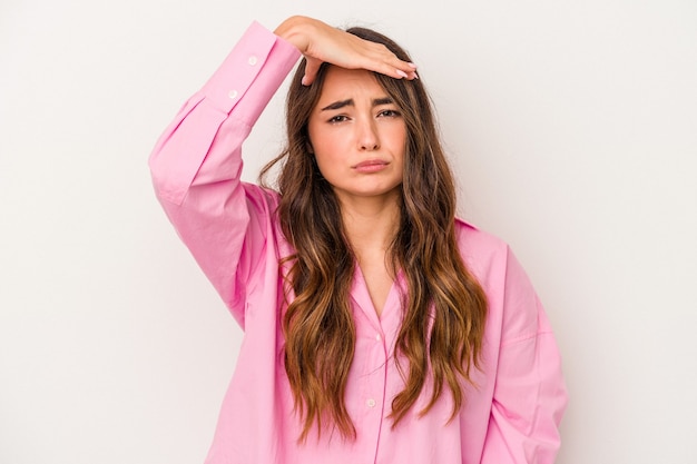 Young caucasian woman isolated on white background touching temples and having headache.