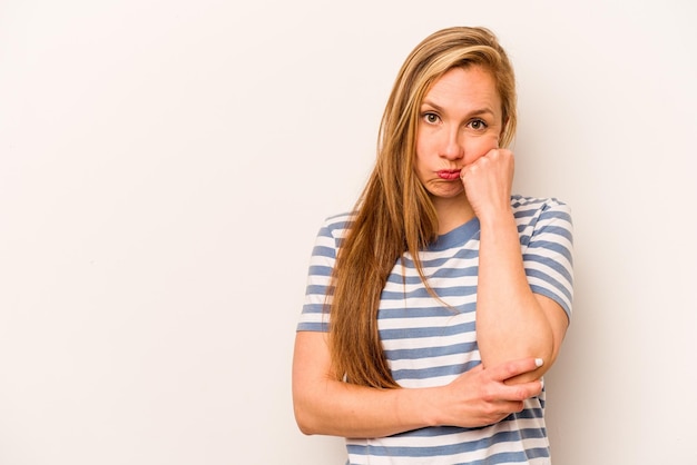 Young caucasian woman isolated on white background who feels sad and pensive looking at copy space