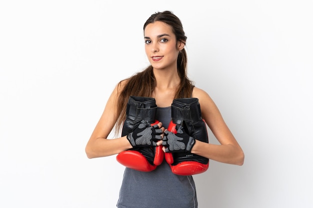 Young caucasian woman isolated on white background with boxing gloves