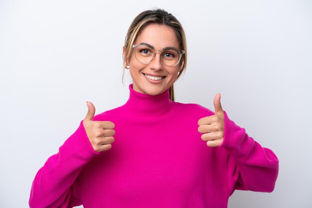 Young caucasian woman isolated on white background With glasses and with thumb up