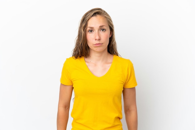 Young caucasian woman isolated on white background with sad expression