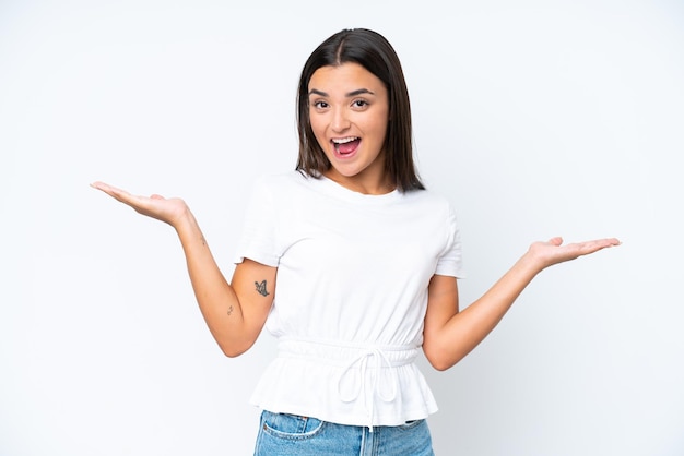 Young caucasian woman isolated on white background with shocked facial expression