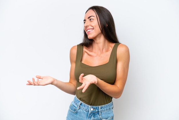 Young caucasian woman isolated on white background with surprise expression while looking side